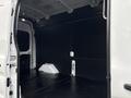 Interior of a 2020 Ford Transit 250 cargo van showing a spacious, empty loading area with a black wall and floor