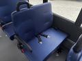 A blue fabric seat with seatbelt straps designed for a passenger vehicle