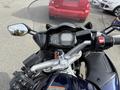 Close-up of a 2016 Yamaha FJR1300AE motorcycle's dashboard featuring gauges buttons and a key ignition