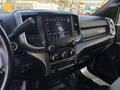 Interior dashboard of a 2021 RAM 5500 featuring a touchscreen display and control knobs for audio and climate settings