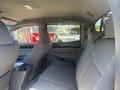 Interior of a 2010 Toyota Tacoma showing the rear seating area with two bucket seats and an armrest between them