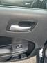 Interior door handle and window control panel of a 2015 Dodge Charger