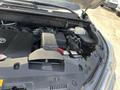 Engine compartment of a 2018 Toyota Highlander showcasing the battery and various engine components