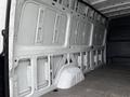 Interior view of a 2019 Mercedes-Benz Sprinter van showing the cargo space with metal walls and flooring designed for transporting goods