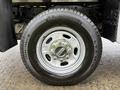 A close-up of a silver alloy wheel with a Michelin tire mounted on a 2019 Ford F-350 SD