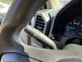 Close-up of the steering wheel of a 2017 Ford F-350 SD showing the turn signal and light control lever on the left side of the wheel