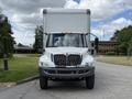 Front view of a 2022 International MV607 truck with a white cab and large boxed cargo area