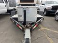 A 2005 Katolight SED60FPJ4 generator mounted on a trailer with a diamond plate toolbox and a hitch connected to the towing vehicle
