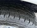 Close-up of a tire from a 2016 GMC Savana showing tread patterns and texture highlighting its grip and wear
