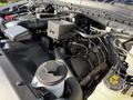 Engine components of a 2021 Ford F-250 SD including hoses a reservoir tank and various fittings