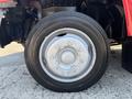 Close-up of a silver wheel with visible lug nuts on a 2007 GMC C4500 TopKick truck