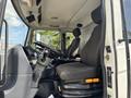 Interior view of a 2012 Autocar Xpert featuring a driver's seat and steering wheel along with control panels and a gear shift next to the seat
