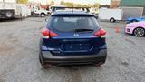Rear view of a blue 2019 Nissan Kicks with a hatchback design and a blank license plate holder