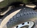 A close-up of a rugged tire from a 2022 Ford Transit showing detailed tread patterns and rim