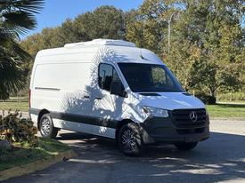 A 2021 Mercedes-Benz Sprinter 2500 van in white with a black lower section and sleek design