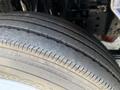 Close-up of a 2016 Isuzu NRR tire showing tread pattern and wear