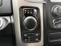 The gear shift dial of a 2018 RAM 1500 featuring settings for park reverse neutral drive and various four-wheel drive options
