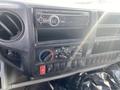 Dashboard of a 2019 Hino 195 featuring a radio and climate control knobs