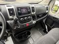 Interior dashboard of a 2020 RAM Promaster featuring a central console with audio system climate controls and a gear shifter