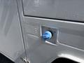 Close-up of a blue fuel cap on the side of a 2017 Ford F-550 truck