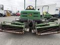 A 2009 John Deere 2653B Precision Diesel Mower with green body and yellow logo featuring dual cutting reels in the front