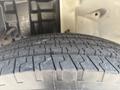 Close-up of the tread on a tire from a 2012 Hino 338 showing detailed patterns and grooves designed for traction and grip