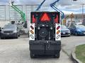 A 2019 Madvac LS175 outdoor vacuum designed for street cleaning with a rear-mounted collection system and visible headlights