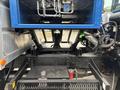 View of the undercarriage and lift mechanism of a 2017 Autocar Xpert showing various hydraulic lines and components