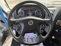 Steering wheel and dashboard of a 2020 Lion Lion6 with various gauges and controls visible