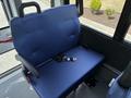 A blue fabric seat with a safety belt designed for a 2020 Chevrolet Express van