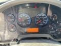 Dashboard of a 2014 International 7400 showing various gauges including speedometer, RPM, fuel level, and engine temperature
