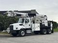 A white 2013 Freightliner 114SD truck with a hydraulic crane mounted on the back and storage compartments on the sides