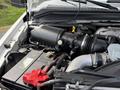 Engine compartment of a 2008 Ford F-250 SD showcasing the air intake system battery and various engine components