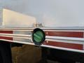 Close-up of a diesel fuel inlet on a 2015 GMC Savana with a green cap and silver metal surrounding the opening