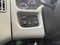 Control panel with buttons for mirror adjustment light settings and panel display on a 2016 International 7400