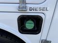 Close-up of the fuel cap on a 2015 Ford F-550 with a diesel fuel indicator and a green dial inside