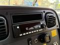 Dashboard of a 2022 Freightliner B2 featuring a radio display unit empty slot control knobs and air conditioning vents
