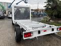 A 2023 RAM Promaster 3500 chassis cab with an open bed and no cargo area visible