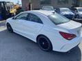 A white 2014 Mercedes-Benz CLA-Class with black alloy wheels parked at an angle