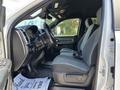 Interior view of a 2021 RAM 5500 showing the driver and passenger seats with gray upholstery and controls on the dashboard
