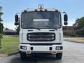 A 2012 Autocar Xpert truck positioned head-on with a flat front grille and visible headlights