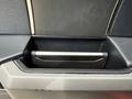 Close-up of the interior door handle of a 2019 Ford F-150 featuring a sleek black design with a metallic accent and a textured surface