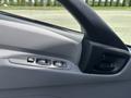 Interior door panel of a 2018 Hino 195 with window controls and a door handle
