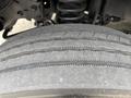 Close-up of a treaded tire from a 2010 Ford F-550 Super Duty showing detailed patterns and grooves