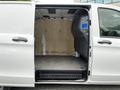 2020 Mercedes-Benz Metris with open side door exposing a clean and spacious cargo area featuring a wooden panel and grey flooring