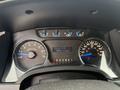 Dashboard of a 2014 Ford F-150 displaying speedometer fuel gauge and odometer reading 1399340 km