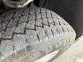 Close-up of a tire from a 2019 Chevrolet Silverado 1500 showcasing its tread pattern and surface texture