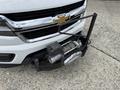 A 2017 Chevrolet Colorado with a black winch mounted on the front bumper and a silver fairlead attached to it