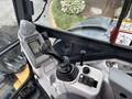 Interior cockpit view of a 2017 John Deere 50G with a control panel featuring a joystick and various buttons and gauges