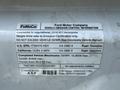 2016 Ford Transit with a label detailing vehicle emission control information and specifications including weight limits and fuel type
